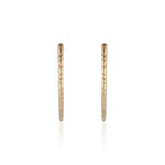 Load image into Gallery viewer, The Erin Hoop earring designed by Natalie McMillan is an absolute staple. Just the right size and none of the heaviness, this hoop is perfect for every day wear.

