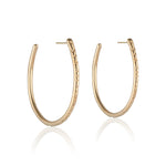 Load image into Gallery viewer, The Erin Hoop earring designed by Natalie McMillan is an absolute staple. Just the right size and none of the heaviness, this hoop is perfect for every day wear.
