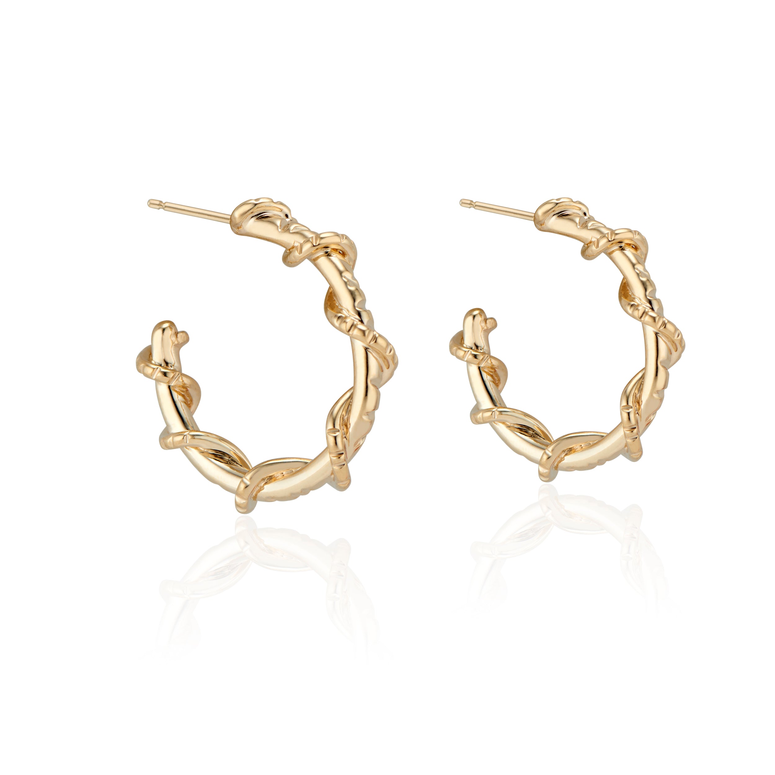 Edgy and fun, these mid sized Spike Hoops feature Natalie McMillan's signature etchings with a literal twist. They are made of solid 14k Gold, so you can wear them every day for a lifetime! 